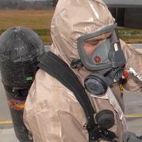 worker wearing protective suit and respirator